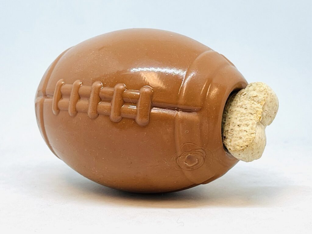 An image of SodaPup – True Dogs, LLC – MKB Football Treat Dispenser – Medium – Brown