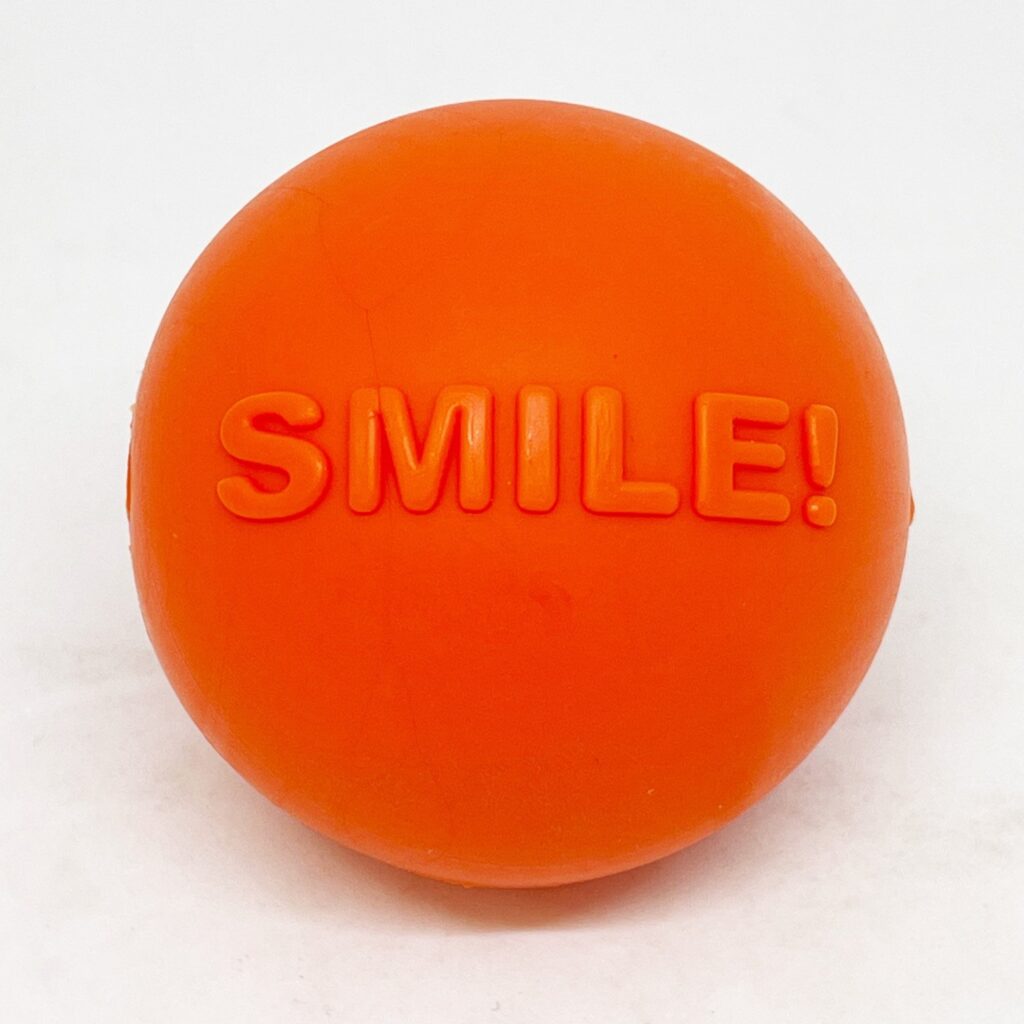 An image of SodaPup – True Dogs, LLC – SP TPE Smile Ball Medium – Bright Orange